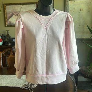 Fate size small pink sweatshirt with ruffle detail, and 3/4 length sleeves
